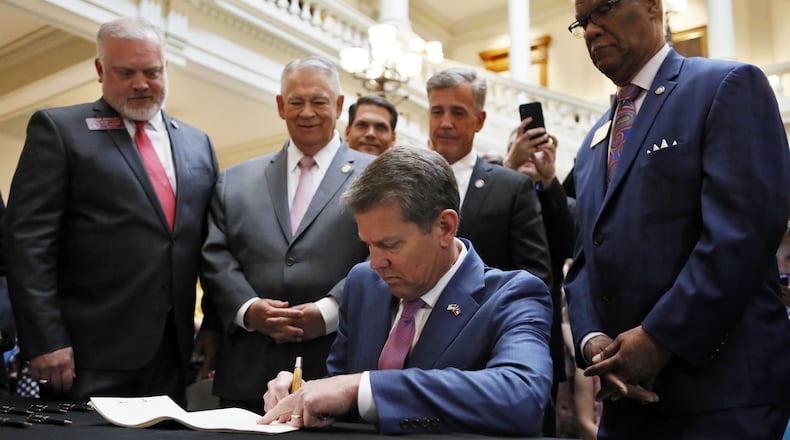 Atlanta - Gov. Brian Kemp, joined by medical marijuana users and advocates on April 17, 2019, signed HB 324, a bill that will allow medical marijuana oil to be sold in Georgia for the first time. The legislation would provide a way for the state's 9,000-plus medical marijuana patients to buy the drug they're already allowed to use. Bob Andres / bandres@ajc.com