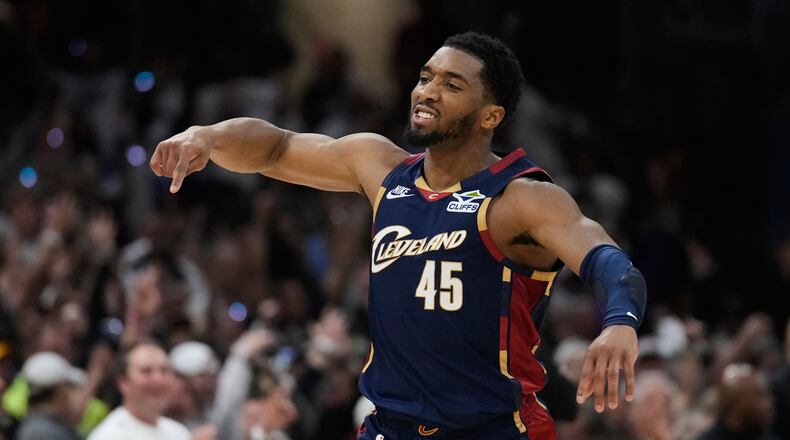 Cleveland Cavaliers' Donovan Mitchell (45) gestures after hitting a three-point basket inthe second half of Game 4 of a second-round NBA basketball playoff series against the Detroit Pistons Monday, May 11, 2026, in Cleveland. (AP Photo/Sue Ogrocki)
