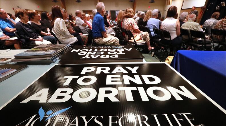 More than 200 anti-abortion activists listen to keynote speaker Shawn Carney, the creator of 40 Days For Life, during a kickoff program in September for a 40-day vigil at St. Joseph Catholic Church in Marietta. Curtis Compton/ccompton@ajc.com