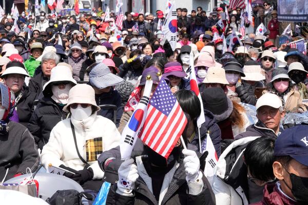 Supporters of impeached South Korean President Yoon Suk Yeol react after hearing the Constitutional Court's verdict removing him from office during a rally in his support near the presidential residence in Seoul, South Korea, Friday, April 4, 2025. (AP Photo/Ahn Young-joon)