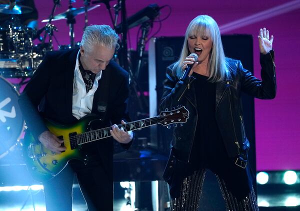 Neil Giraldo, left, and Pat Benatar perform during a tribute to Icon award winner Pink at the iHeartRadio Music Awards on Monday, March 27, 2023, at the Dolby Theatre in Los Angeles. (AP Photo/Chris Pizzello)