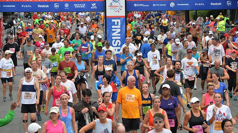 60,000 runners take part in the annual July 4th AJC Peachtree Road Race.
