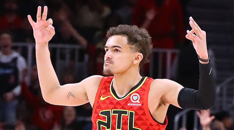 Atlanta Hawks guard Trae Young hits a three on the way to beating the Milwaukee Bucks 136-135 during overtime in a NBA basketball game on Sunday, March 31, 2019, in Atlanta.    Curtis Compton/ccompton@ajc.com