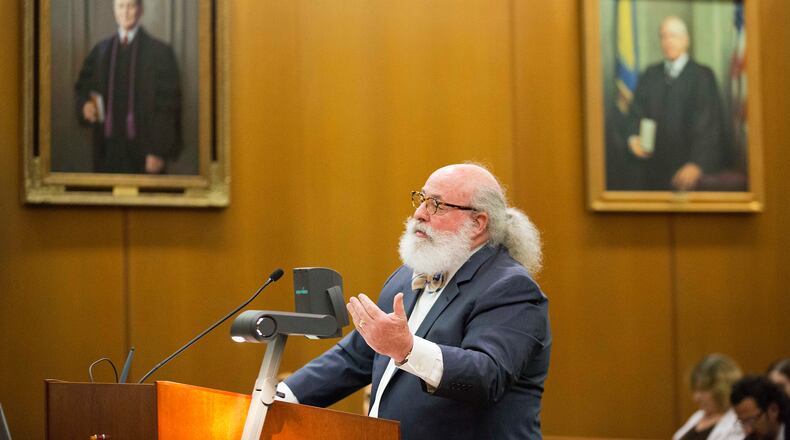 Attorney Alan Begner, representing a Ku Klux Klan group, argues before the Georgia Court of Appeals on whether the state violated the group's constitutional rights by denying its application in a highway cleanup program Thursday, July 9, 2015, in Atlanta. The Georgia Court of Appeals heard arguments in the case Thursday and will issue a decision in the coming months. The Georgia group's application for the Adopt-A-Highway program was denied in 2012. The American Civil Liberties Union Foundation sued on the group's behalf, saying its right to free speech was violated. (AP Photo/David Goldman)