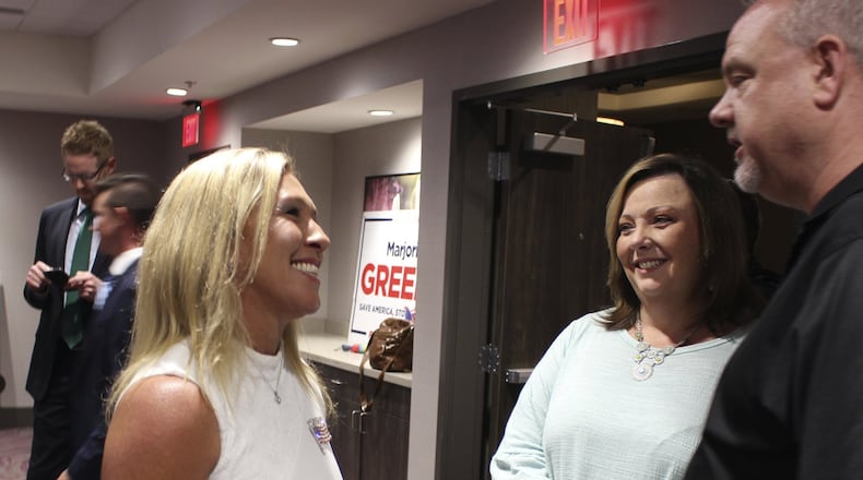 Before Marjorie Taylor Greene, left, became a GOP candidate in Georgia’s 14th Congressional District she was running in the 6th District. Greene, who lived in Alpharetta, now rents a home in Rome, her campaign says. For some voters, her residency is an issue, but she also was the biggest vote-getter in the conservative district’s GOP primary on June 9. (Olivia Morley/The Rome News-Tribune via AP)