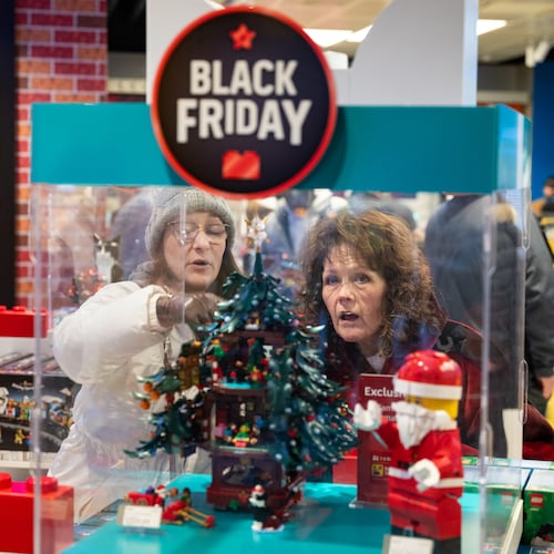 Black Friday shoppers admire a Christmas LEGO set at the LEGO flagship store in New York on Friday, Nov. 28, 2025. (AP Photo/Angelina Katsanis)