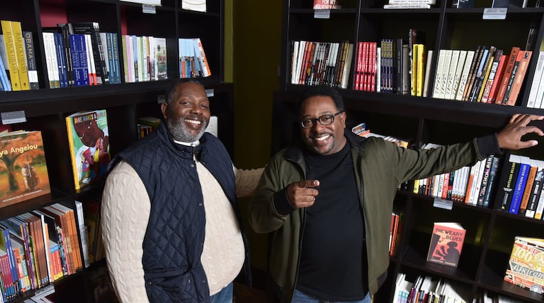 Brothers Darrick Hargro (left) and Carlton Hargro at Moods Music, where they celebrated the release of their comic book “Moses,” one of three titles they published this year featuring African-American superheroes. HYOSUB SHIN / HSHIN@AJC.COM