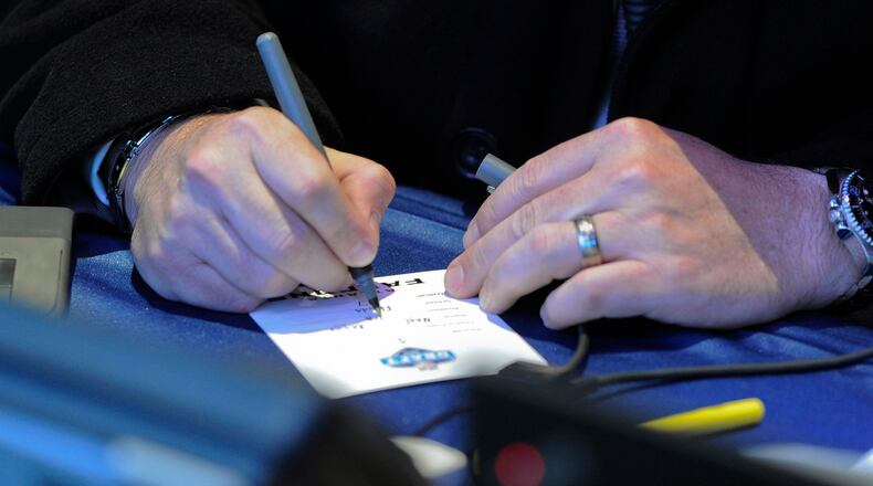 An Atlanta Falcons representative marks the team's decisions during the first round of the NFL football draft Thursday, April 28, 2016, in Chicago. (Matt Marton/AP)