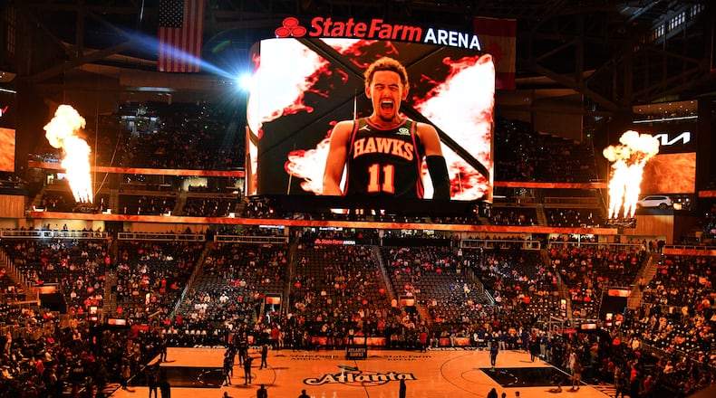 Hawks players are introduced as the hardwood court is specially decorated with the Peach emblem before their game against the Philadelphia 76ers at State Farm Arena on Thursday, November 10, 2022. (Hyosub Shin / Hyosub.Shin@ajc.com)