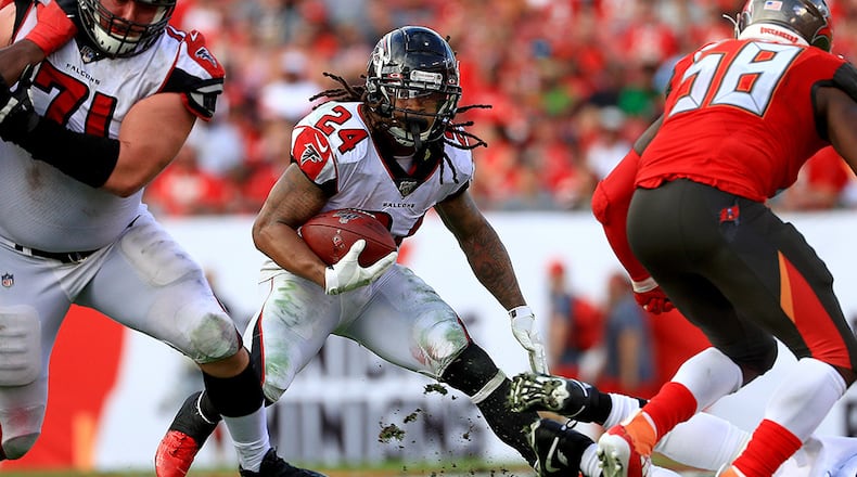 Falcons running back Devonta Freeman rushes during against the Tampa Bay Buccaneers  in the regular season finale Sunday, Dec. 29, 2019, at Raymond James Stadium in Tampa, Fla. Freeman finished the season with just under 600 yards rushing.