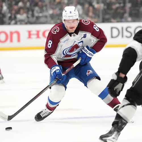 Colorado Avalanche's Cale Makar (8) brings the puck across the blue line against Los Angeles Kings during the first period of Game 4 in the first round of an NHL hockey Stanley Cup playoff series Sunday, April 26, 2026, in Los Angeles. (AP Photo/Scott Strazzante)