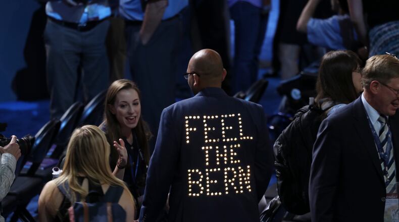 A delegate's jacket lights up in support of Bernie Sanders inside the Wells Fargo Center on the first day of the Democratic National Convention in Philadelphia, July 25, 2016. (Jim Wilson/The New York Times)