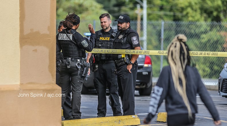 Police have blocked off the parking lot of the Oyo Hotel on Wesley Club Drive with crime scene tape.