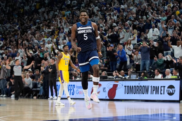Minnesota Timberwolves guard Anthony Edwards (5) celebrates after making a 3-point shot during the second half of Game 3 of an NBA basketball first-round playoff series against the Los Angeles Lakers, Friday, April 25, 2025, in Minneapolis. (AP Photo/Abbie Parr)
