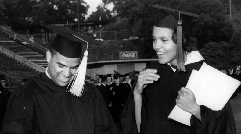Hamilton Holmes and Charlayne Hunter examine diplomas awarded during the University of Georgia's 160th commencement in Athens on June 2, 1963. (AP)
