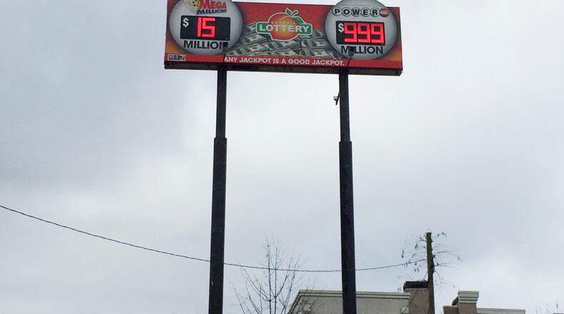 As of Jan. 10, 2016, the Powerball jackpot was expected to reach $1.3 billion. What to do with signs like these? (Credit: Channel 2 Action News)