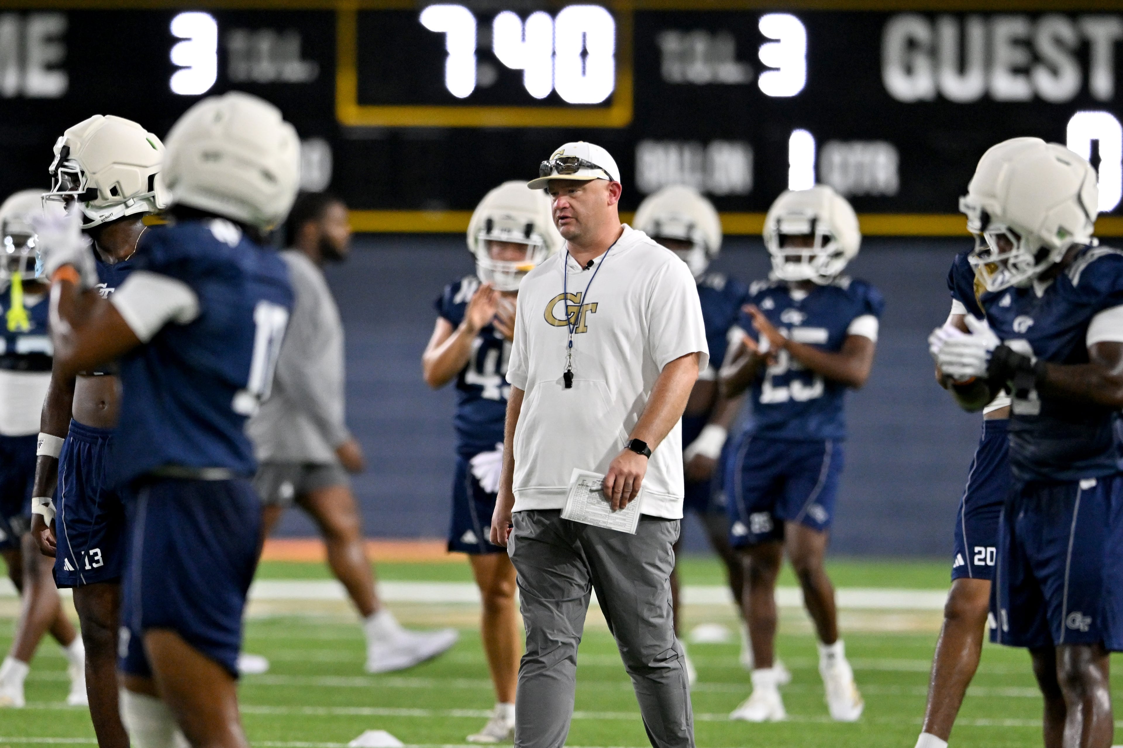 Georgia Tech head coach Brent Key walks on the practice field during the first day of football practice at Rose Bowl Field and the Mary and John Brock Football Practice Facility, Tuesday, July 29, 2025, in Atlanta. (Hyosub Shin / AJC)