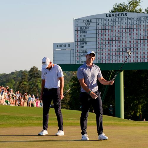 Rory McIlroy, of Northern Ireland, waves after his putt on the 18th hole during the third round of the Masters golf tournament at the Augusta National Golf Club, Saturday, April 11, 2026, in Augusta, Ga. (AP Photo/David J. Phillip)