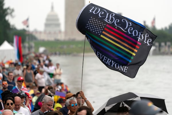 People participate in the World Pride Rally at the Lincoln Memorial, Sunday, June 8, 2025, in Washington. (AP Photo/Jose Luis Magana)