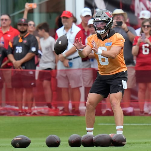Tampa Bay Buccaneers quarterback Baker Mayfield takes a snap during an NFL football training camp practice Thursday, July 30, 2026, in Tampa, Fla. (AP Photo/Chris O'Meara)