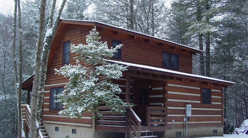There's just something primordially appealing about a cabin in the snow - the implied shelter and warmth of the cozy inside, with a fireplace and maybe, just maybe, a hot tub! This one's a Fall Creek Cabins rental up around Boone, N.C.