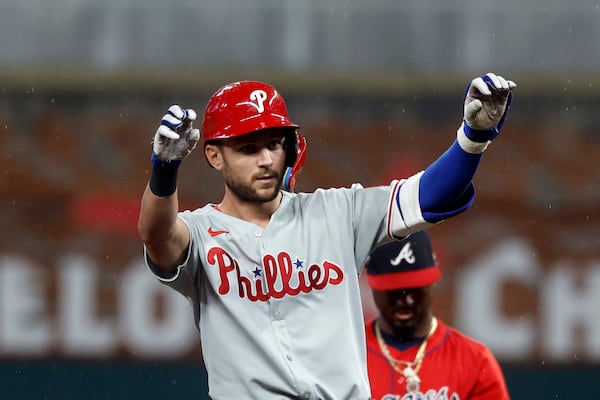 Philadelphia Phillies' Trea Turner reacts after hitting a double during the first inning of a baseball game against the Atlanta Braves, Friday, June 27, 2025, in Atlanta. (AP Photo/Butch Dill)