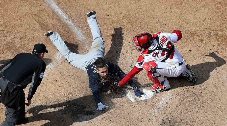 The Braves’ Ender Inciarte is tagged by Nationals catcher Pedro Severino for the third out of the 10th inning when Inciarte tried to steal home. (Photo by Rob Carr/Getty Images)