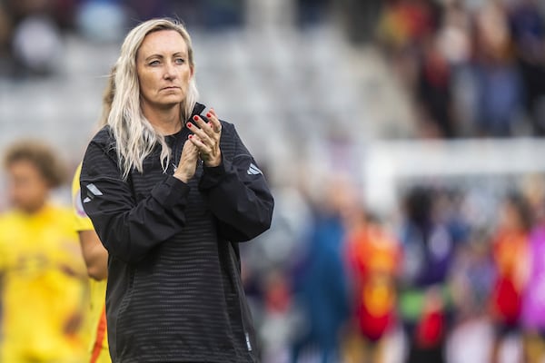 Belgium's head coach Elisabet Gunnarsdottir applauds after the UEFA Women's EURO 2025 Group B soccer match between Spain and Belgium at the Stockhorn Arena in Thun, Switzerland, Monday, July 7, 2025. (Til Buergy/Keystone via AP)