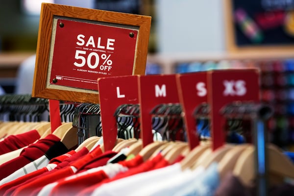 FILE - A sale sign is displayed on a rack of clothes at a store in Chicago, June 10, 2024. (AP Photo/Nam Y. Huh, file)