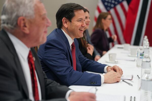 U.S. Secretary of State Marco Rubio smiles during a meeting with Trinidad and Tobago Prime Minister Stuart Young at the U.S. embassy in Kingston, Jamaica, Wednesday, March 26, 2025. (Nathan Howard/Pool Photo via AP)