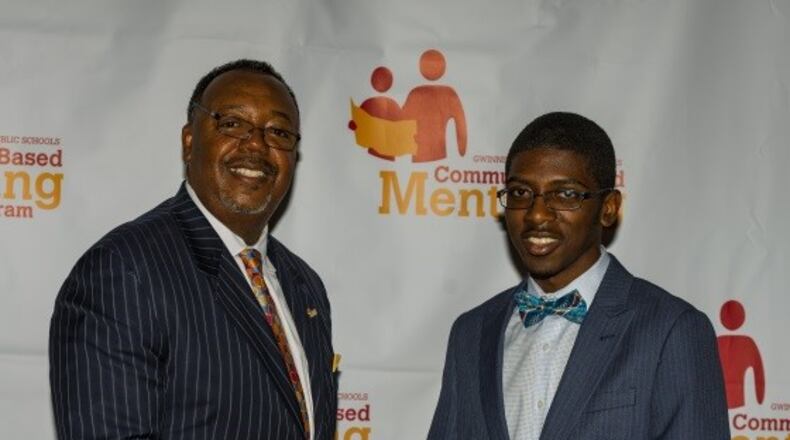 James Rayford, Gwinnett County Public Schools’ director of community-based mentoring, and scholarship recipient Joshua Boose.