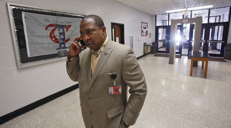 Clarence Cox III, who became the head of security at the start of the school year for Clayton County Public Schools, at Riverdale High School during a drug and weapons sweep. Using explosive and drug sniffing dogs, Clayton law enforcement held a sweep of the school district’s high schools wednesday, which netted some marijuana. The operation was a collaboration of the Clayton County sheriff’s office, police department and the school district’s new security force. The sweep will included lockers, gym lockers and cars in the parking lots. BOB ANDRES / BANDRES@AJC.COM