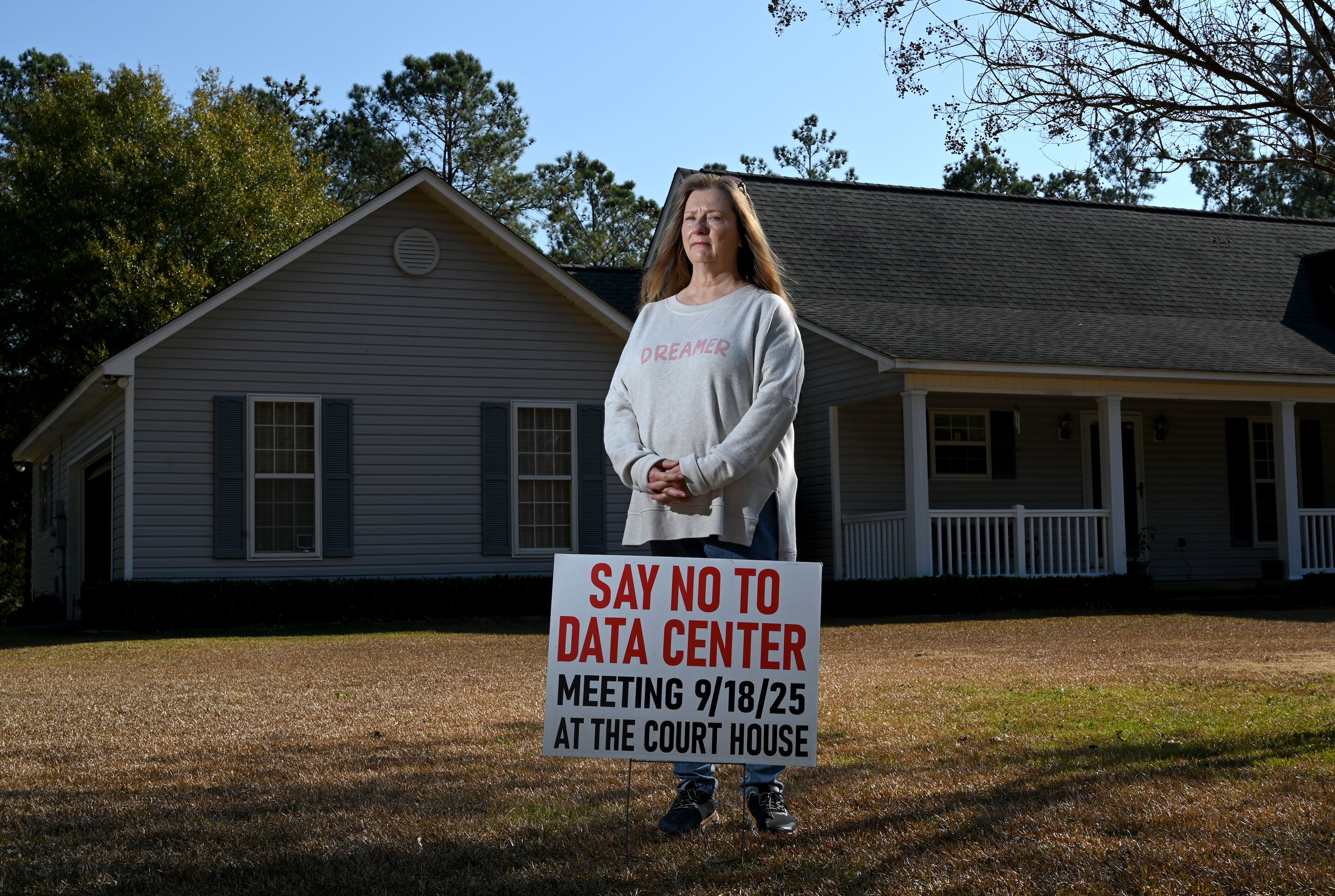 Nancy Lubeck, a Twiggs County resident who lives about a mile from the data center site, poses for a portrait at her home, Wednesday, Nov. 19, 2025, in Dry Branch. An effort to rezone about 300 acres of timberland for a data center in Twiggs County is drawing widespread criticism from residents. (Hyosub Shin/AJC)