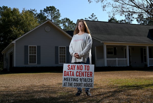 Nancy Lubeck, a Twiggs County resident who lives about a mile from the data center site, poses for a portrait at her home, Wednesday, Nov. 19, 2025, in Dry Branch. An effort to rezone about 300 acres of timberland for a data center in Twiggs County is drawing widespread criticism from residents. (Hyosub Shin/AJC)