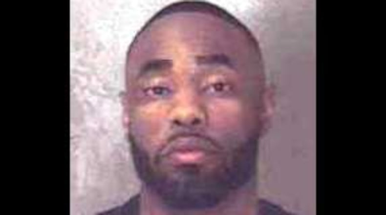 Ajamia Guyton, a now-former DeKalb County police officer, was fired for allegedly tampering with a crime scene.