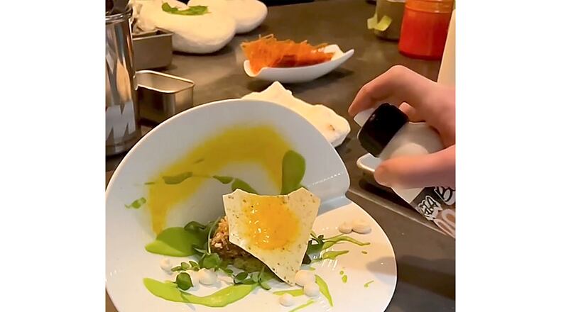 For the Krog Street Tunnel Lamb dish at Georgia Boy, a peculiar-looking bent plate and tableside finish of edible carrot spray elicit surprise and disbelief.