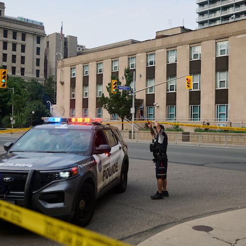 Police work the scene of an early morning shooting outside the US Consulate in Toronto, on Monday, July 27, 2026. (Sammy Kogan/The Canadian Press via AP)