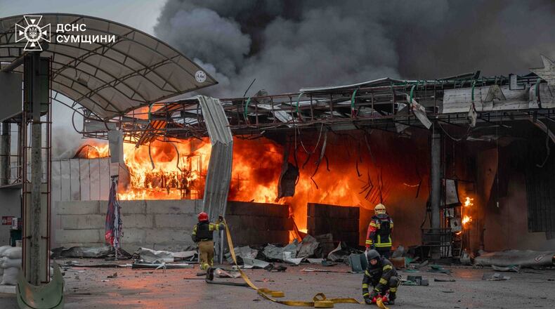 In this photo provided by the Ukrainian Emergency Service, firefighters put out a fire in a gas station following a Russian air attack in Sumy, Ukraine, Thursday, June 25, 2026. (Ukrainian Emergency Service via AP)