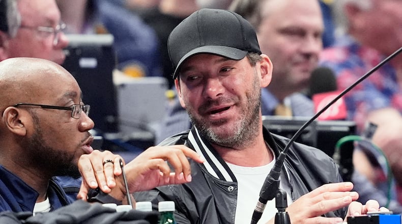 FILE - Former NFL quarterback Tony Romo, right, attends an NBA basketball game between the Indiana Pacers and the Dallas Mavericks on March 5, 2024, in Dallas. (AP Photo/Tony Gutierrez, File)