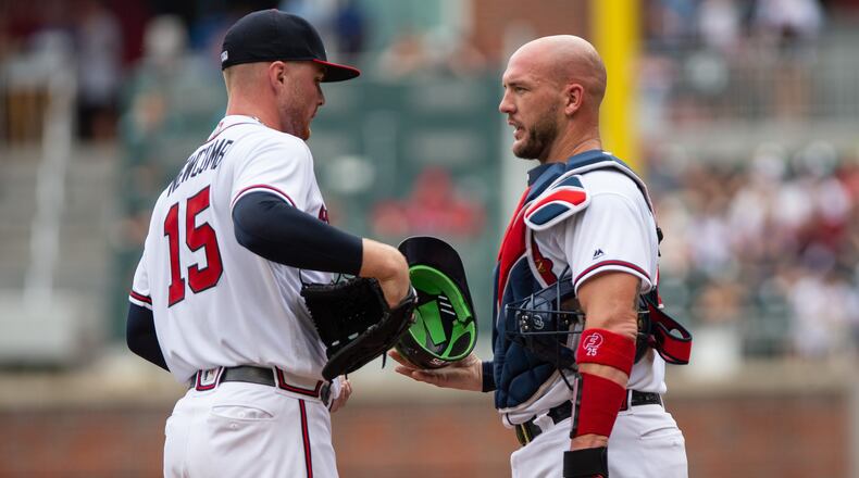 Catcher Tyler Flowers  of the Atlanta Braves talks things over with pitcher Sean Newcomb of the Atlanta Braves after Newcomb gave up three runs in the first inning to the Washington Nationals at SunTrust Park on September 16, 2018 in Atlanta, Georgia.(Photo by Kelly Kline/GettyImages)