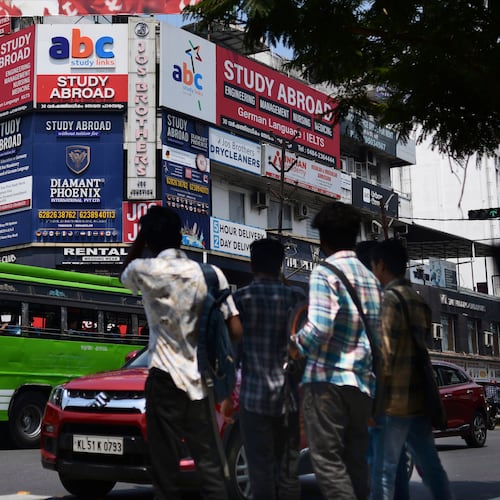 FILE - Sign boards of various educational consultants that attract youth to study abroad cover the façade of a building in Kochi, Kerala state, India, March 7, 2023. (AP Photo/ R S Iyer, File)