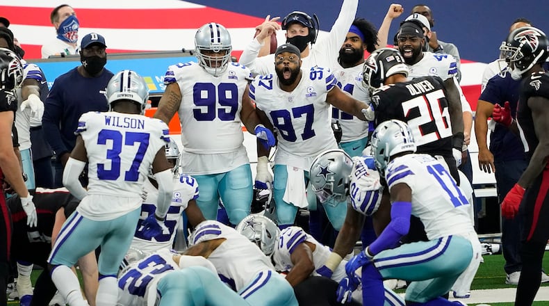 Dallas Cowboys defensive end Everson Griffen (97) reacts with teammates on the bench as defensive back C.J. Goodwin recovers an onside kick late in the fourth quarter against the Atlanta Falcons on Sunday, September 20, 2020 at AT&T Stadium in Arlington, Texas. (Smiley N. Pool/The Dallas Morning News/TNS)