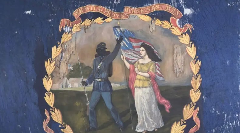 A rare Civil War battle flag from a regiment of U.S. Colored Troops shows a black soldier bidding farewell to a female figure representing "Columbia." The flag was acquired Thursday, June 13, by the Atlanta History Center. CONTRIBUTED: MORPHY AUCTIONS