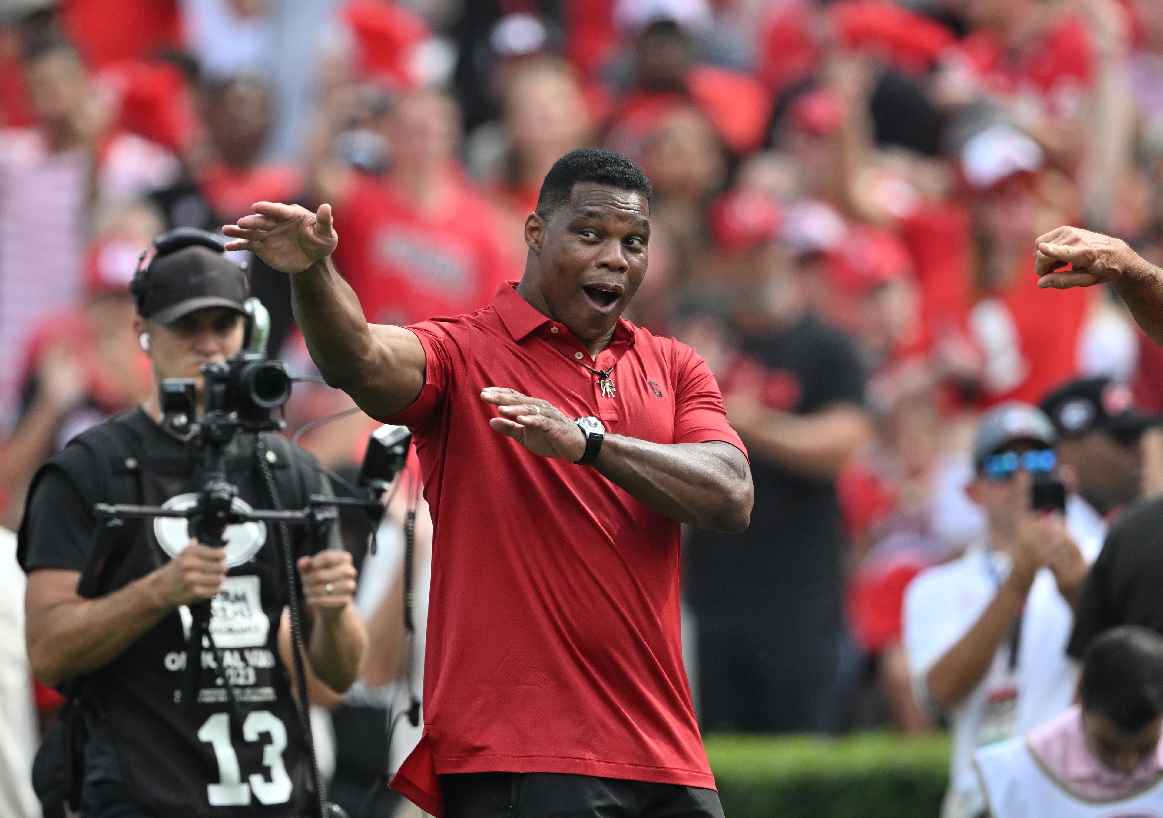 Herschel Walker is recognized during the first half in an NCAA football game at Sanford Stadium, Saturday, August 30, 2025, in Athens. (Hyosub Shin / AJC)