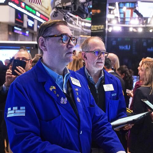 Specialist Patrick King, left, and trader Mark Puetzer work on the floor of the New York Stock Exchange, Wednesday, Jan. 28, 2026. (AP Photo/Richard Drew)