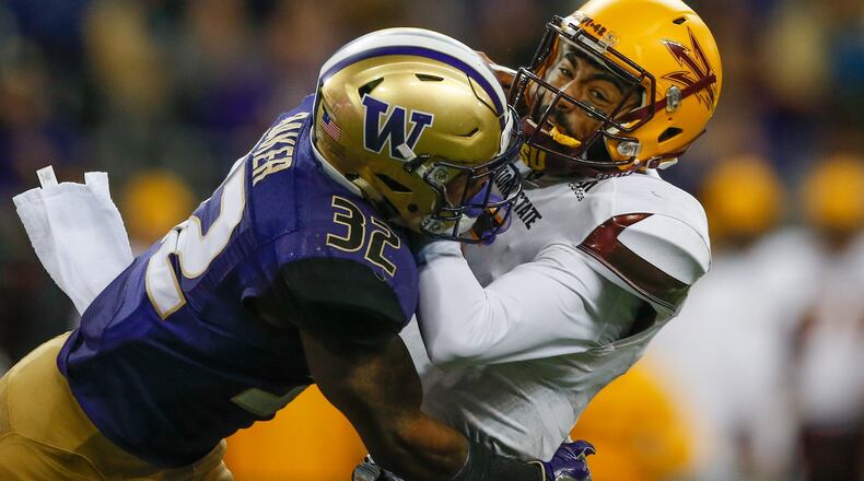 Quarterback Manny Wilkins of the Arizona State Sun Devils is sacked by defensive back Budda Baker of the Washington Huskies on November 19, 2016 at Husky Stadium in Seattle, Washington. (Photo by Otto Greule Jr/Getty Images)