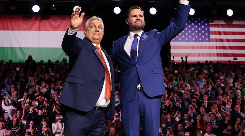 U.S. Vice President JD Vance and Hungarian Prime Minister Viktor Orban, left, wave to the audience during a Day of Friendship event in Budapest, Hungary Tuesday, April 7, 2026. (Jonathan Ernst/Pool Photo via AP)