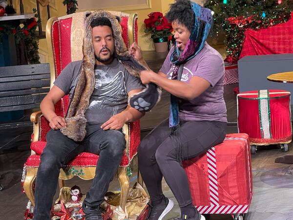 Improvisers Freddy Boyd and Jamila Porter rehearse a scene from “Y’allmark Christmas.”