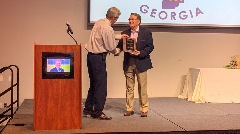 At his retirement ceremony, Cherokee County Manager Jerry Cooper was honored with a prestigious award. Pictured L to R is ACCG Executive Director Dave Wills and Cherokee County Manager Jerry Cooper. CONTRIBUTED