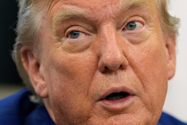 President Donald Trump talks with reporters as he meets with members of the Juventus soccer club in the Oval Office of the White House, Wednesday, June 18, 2025, in Washington. (AP Photo/Alex Brandon)
